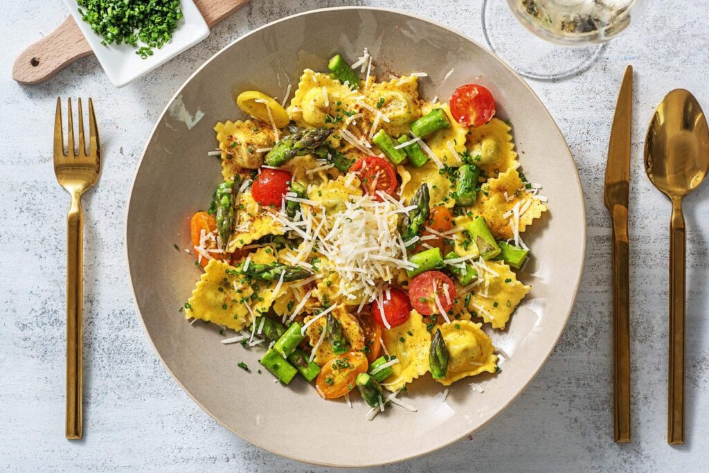 Truffled Lobster Ravioli  with asparagus and Heirloom Grape Tomatoes