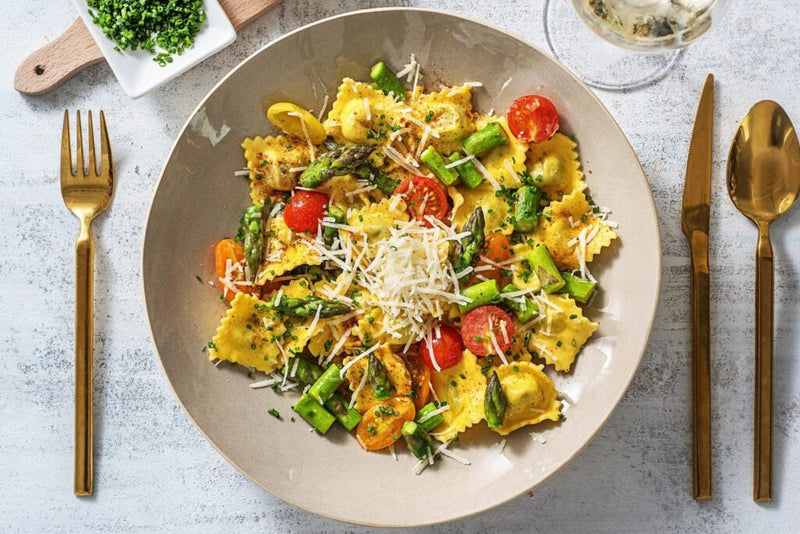 Truffled Lobster Ravioli  with asparagus and Heirloom Grape Tomatoes